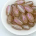 Detail shot of 18mm mermaid glitter oval beads, perfect for DIY jewelry making and crafting. - Light Brown