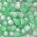 Close-up detail of green and white resin cat eye beads for DIY handmade jewelry making. - Gradient Green