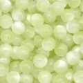 Resin cat eye beads detail close up texture view showing smooth surface and pearlescent shine. - Light Green