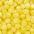 Close up of yellow resin cat eye beads detail, perfect for DIY jewelry making and crafts. - Yellow