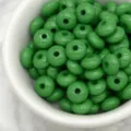 Green wheel spacer beads detail shot, smooth surface with center hole for DIY jewelry making - Green