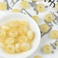 Detailed view of light yellow resin abacus beads, perfect for DIY jewelry and crafts. - Beige