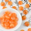Details of orange resin cat's eye abacus beads for DIY bracelets and hair accessories. - Orange