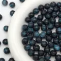 Resin starry beads close up detail view, sparkly round loose beads for DIY jewelry making. - Brilliant Black