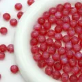 Red starry resin beads close-up detail shot, perfect for DIY jewelry making and bracelets. - Red
