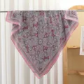 Detail view of a vintage paisley print square scarf with classic pink and red motifs. - RY-27