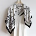 Elegant black and white grid silk scarf featuring classic camellia floral print detail. - RY-09