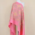 Detailed view of pink cashmere shawl with gold embroidery, floral pattern and elegant fringe. - Peach