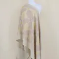 Detailed view of the luxury cashmere blend shawl with gold embroidery and floral patterns. - Off White