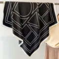 Detail shot of a chic black and white geometric print square silk scarf for women stylish. - Geometric Letters-Black