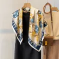 Detail shot of vintage floral square scarf with blue and yellow flower print and elegant border. - Woven Flower-Beige