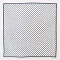Detail view of a classic black and white polka dot cotton square scarf and retro bandana. - 54*54CM / White