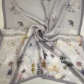 Silk square scarf featuring an elegant watercolor floral print with soft tones and a chic gray border. - Grey Base Dandelion Scarf