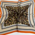 Leopard print silk square scarf with geometric borders, soft and elegant accessory. - Orange and Brown Leopard Print Scarf