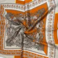 Luxury silk square scarf featuring vintage floral paisley prints in elegant orange and beige tones. - Paisley on Orange Background