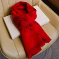 Festive red winter scarf featuring traditional Chinese blessing characters and auspicious cloud patterns. - Auspicious Clouds and Blessed Green