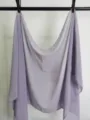 Detail view of a light purple solid chiffon scarf hanging, soft lightweight fabric texture display. - Light Purple