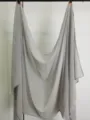 Detailed view of a solid color grey chiffon scarf, lightweight and versatile for all seasons. - Silver