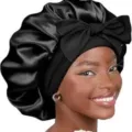 Zwarte sateen slaapmuts voor vrouwen, elegante haarnachtmuts met grote strik voor haarverzorging. - 58 cm hoofdomtrek (één maat) / Zwart