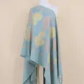 Detailed view of the embroidered cashmere shawl featuring elegant paisley patterns and fringe. - Color 098