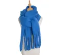 Close-up detail of the soft blue fluffy winter scarf showcasing cozy texture and fringe accents. - Sapphire Blue