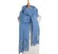 Blue loop yarn winter scarf detail showing soft texture and fringe design close up. - Denim Blue