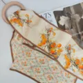 Silk twilly scarf with orange persimmon branch print and brown border for elegant women styling - Hand-Painted Persimmon Tree on Apricot White