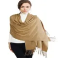 Detail view of winter solid color imitation cashmere shawl with elegant fringe design. - Camel