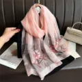 Close-up detail of luxurious pink silk wool shawl featuring delicate floral embroidery craft. - 74.8*27.5inch / Pink