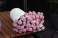 Handmade crochet rose blanket shaped like a fresh flower bouquet, cozy pink wearable shawl. - Sweet Pink