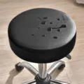 Tabouret pivotant rond en cuir noir avec roulettes et coussin d'assise imperméable salon. - Noir