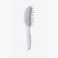 White curved vent hair brush detangling comb for smooth styling and daily hair care routine. - White