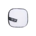 White square facial cleansing sponge with black edges and tag for daily makeup routine. - Black and White
