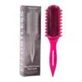 Peigne coiffeur à neuf rangs avec manche rose ergonomique et poils noirs pour des boucles. - Emballage en boîte / Rose