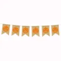 Halloween burlap banner detail showing the orange jack-o-lantern printed festive flags. - Yellow Pumpkin