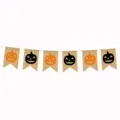 Halloween party burlap banner with printed pumpkin faces for holiday decoration detail. - Black and Yellow Pumpkins