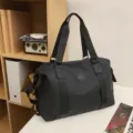 Large capacity black travel duffel bag, lightweight waterproof weekend luggage tote for women. - Black