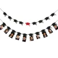 Detailed close-up view of the graduation party banner featuring photo clips and mortarboard cutouts. - Combination Banner / 20 Wooden Pegs