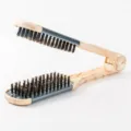 V-shaped hair straightening brush with wooden grain handle and dual side bristles for salon styling. - Silver