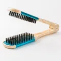 V-shaped hair straightening brush with wood grain handle, turquoise accent and black bristles. - Blue