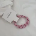 Detailed shot of two-pack pink braided hair ties with candy colors and high elasticity. - 2 Pieces/Pack / Pink