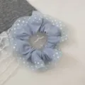 Sweet polka dot hair scrunchie with delicate lace overlay, perfect for styling cute ponytails. - Blue