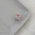 Close-up detail of a cute mini pink hair claw clip featuring a silver bow and blue crystal. - Blue Bowknot - Pink Claw
