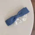 Detailed view of sweet denim bow hair clip with white lace trim, cute girl side clip accessory. - Blue Ruffle Lace Hair Clip