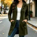 Detail view of dark green fleece hooded long zip-up casual sweatshirt jacket for women. - Burgundy