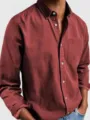 Close-up detail of the men's long-sleeve casual button-down shirt featuring a chest pocket. - S / Burgundy