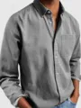 Detailed view of men's casual long sleeve cotton button-up shirt with chest pocket. - S / Pink