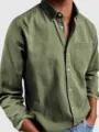 Close-up view of men's olive green long sleeve button down casual shirt with chest pocket. - S / Army Green