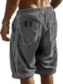 Back detail view of men's casual corduroy shorts featuring back pocket and drawstring. - S / Light Green