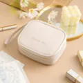 Tragbare Mini-Damenbinden-Aufbewahrungstasche wasserdicht süße Kosmetiktasche beigefarben - Beige